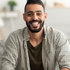 portrait-of-handsome-young-arab-man-smiling-and-lo-2021-12-09-19-23-26-XHBVC4Z.jpg